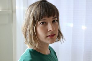 Katie Marya, a white femine presenting person with fair skin and a medium blonde bob